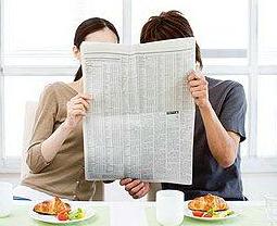 photo: couple reading the paper