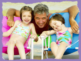 photo: girls with dad at the beach